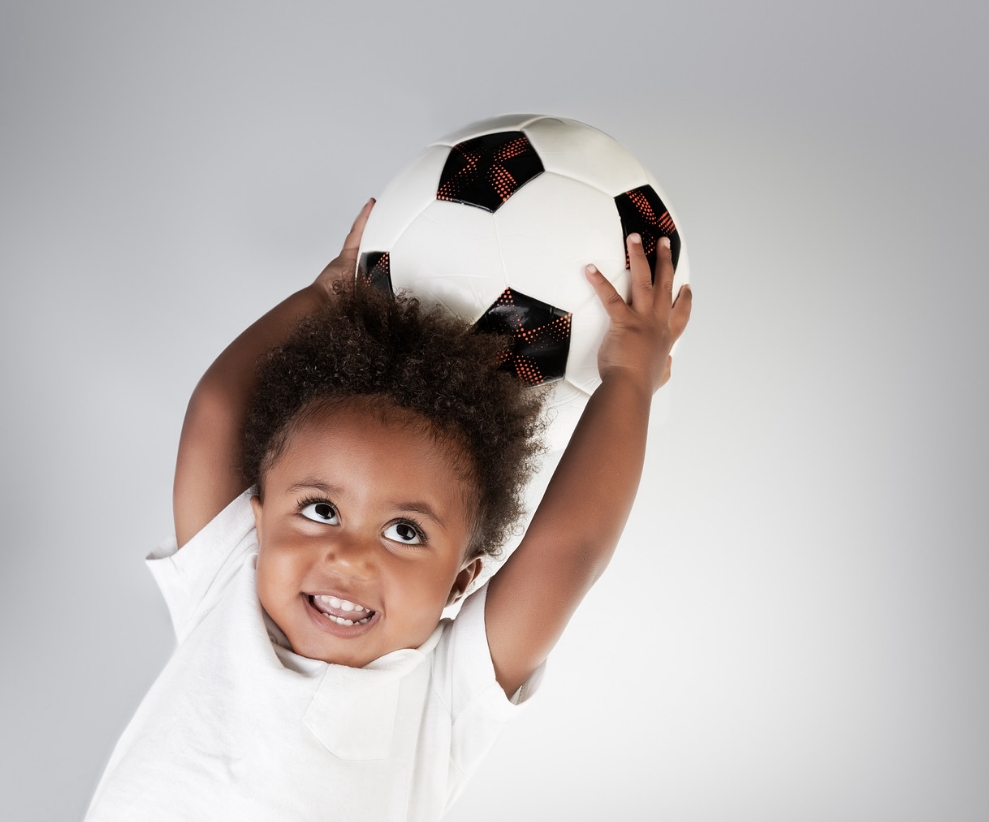 toddler with a football